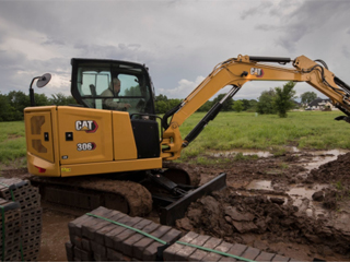 How does Caterpillar introduce edge AI into industrial work sites?